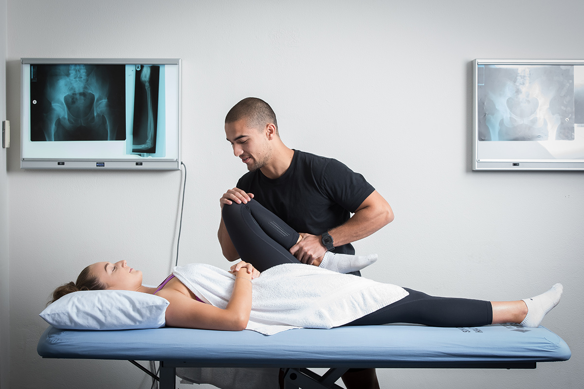 An osteopathy student treating a client in the clinic.